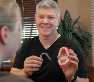orthodontic specialist in denton, tx, showing patient invisalign